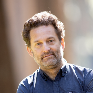 A headshot of David Menschel