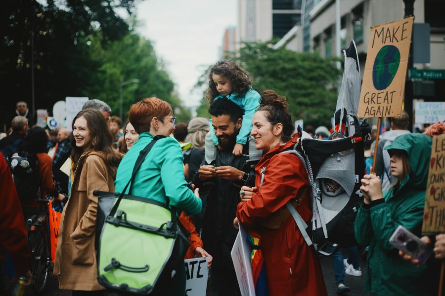 Sarah talking with people at a protest