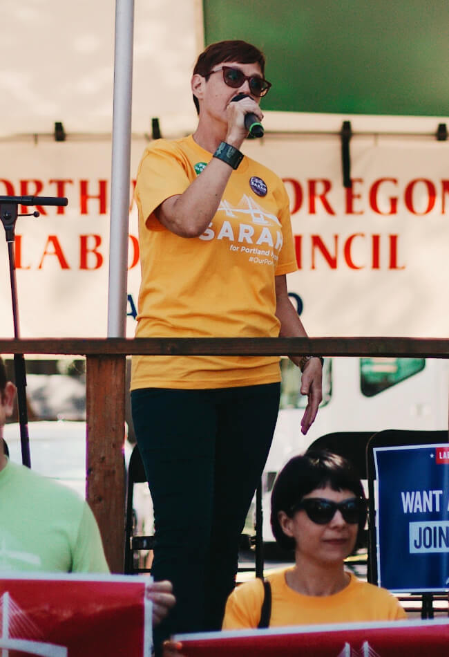 Sarah speaking to a crowd at a campaign event